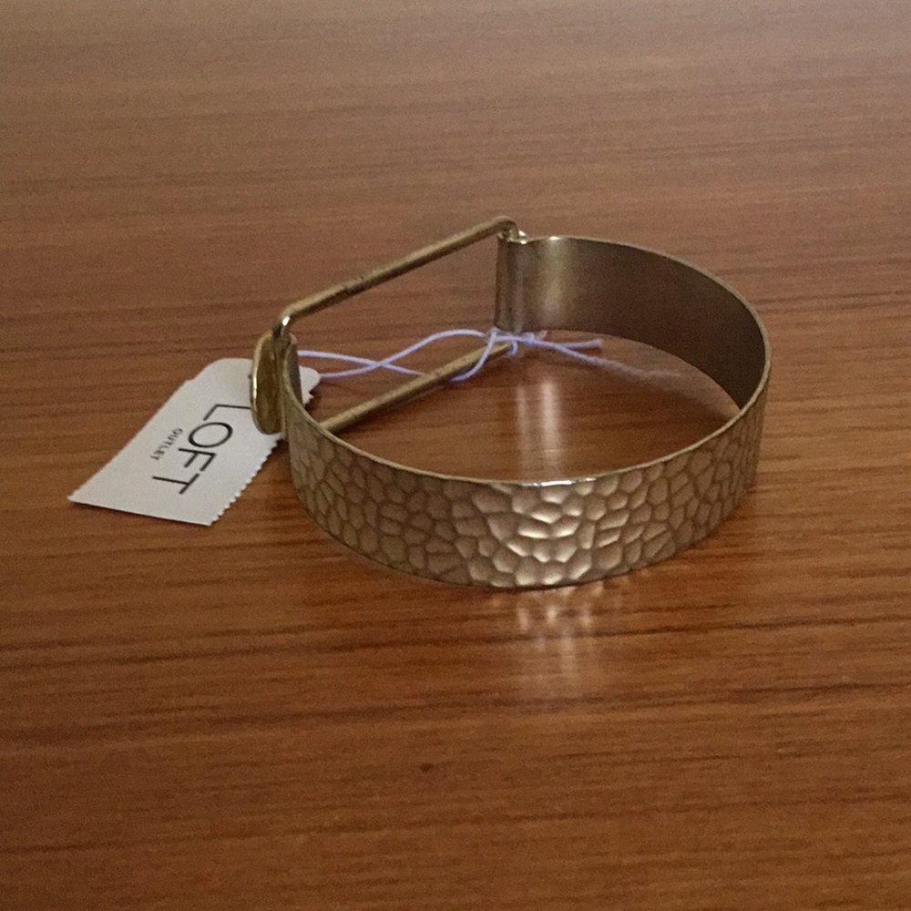 Gold colored cuff type bracelet. NWT